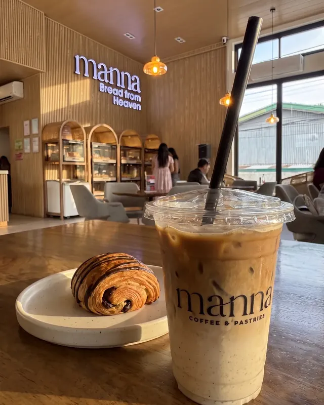 Iced hojicha and pain au chocolat by the Bread from Heaven sign