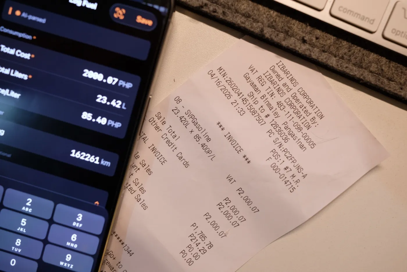 Photographed fuel receipt next to the AI-parsed Log Fuel sheet